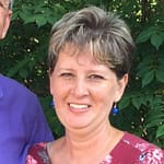 A woman smiling for a picture. A woman smiling for a picture.